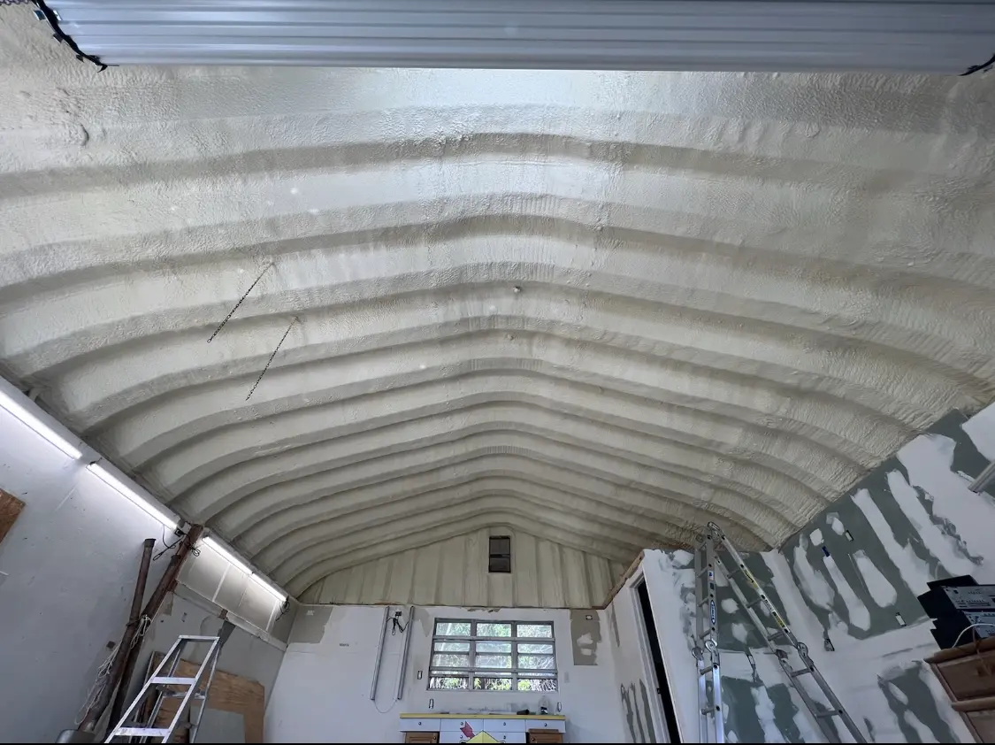 Spray polyurethane foam applied to the underside of a metal roof deck in Forest Acres